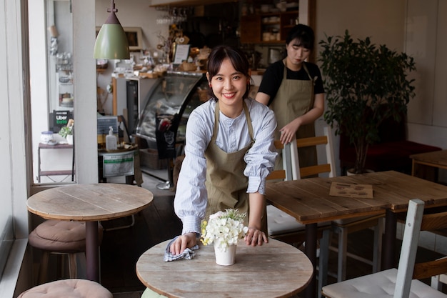 Young women arranging their cake shop