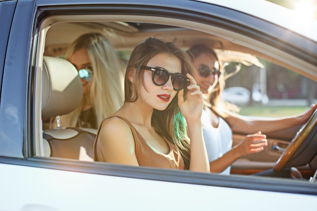 Young women in the car smiling