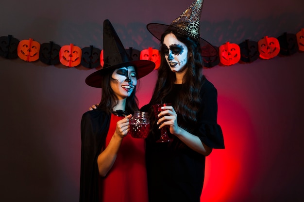 Young women dressed as witches