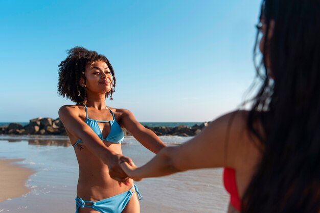 Young women having fun at the beach