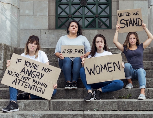 Young women marching for equal rights