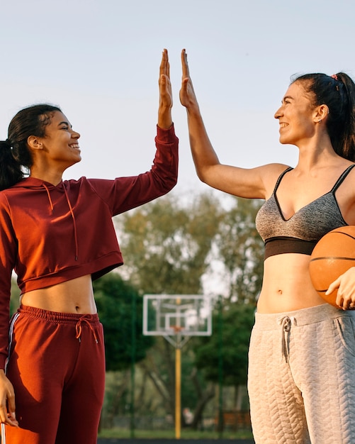 Young women playing basketball