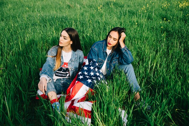 Young women sitting on grass