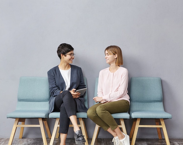 Young women sitting in waiting room