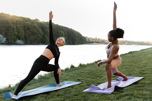 Young women in sportswear working out outdoors