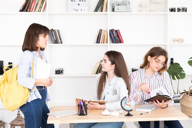 Young women studying in library