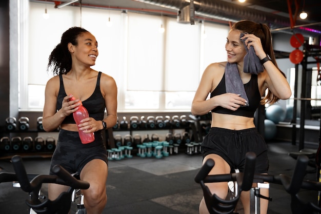 Young women taking part of spinning class