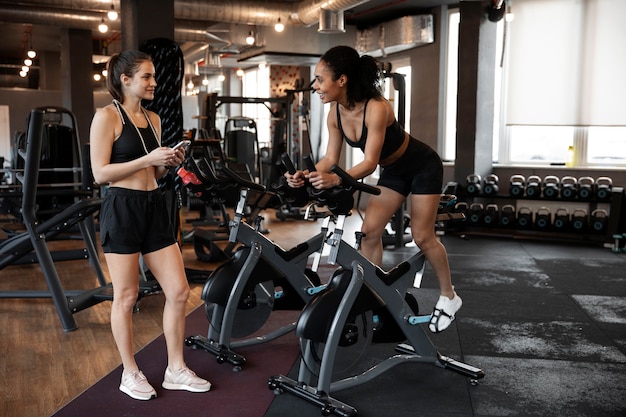 Young women taking part of spinning class