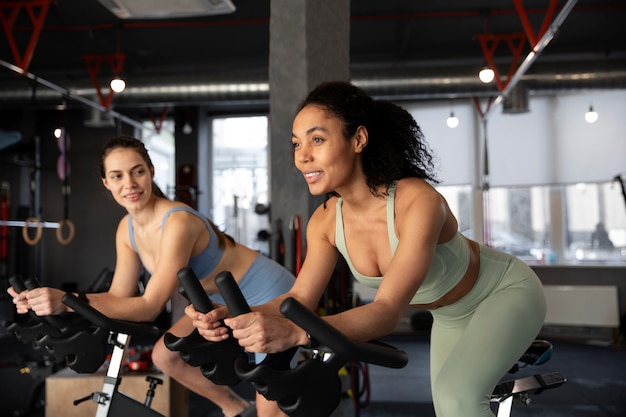 Young women taking part of spinning class