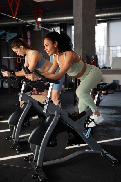 Young women taking part of spinning class