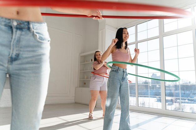 Young women with hula hoops