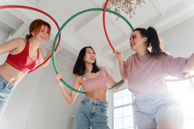 Young women with hula hoops