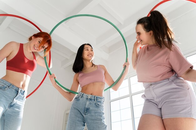 Young women with hula hoops