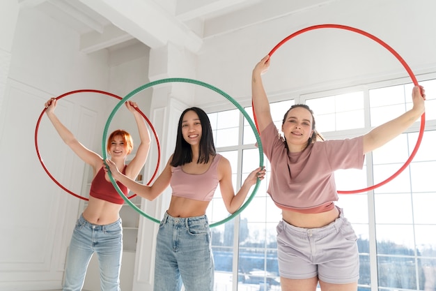Young women with hula hoops