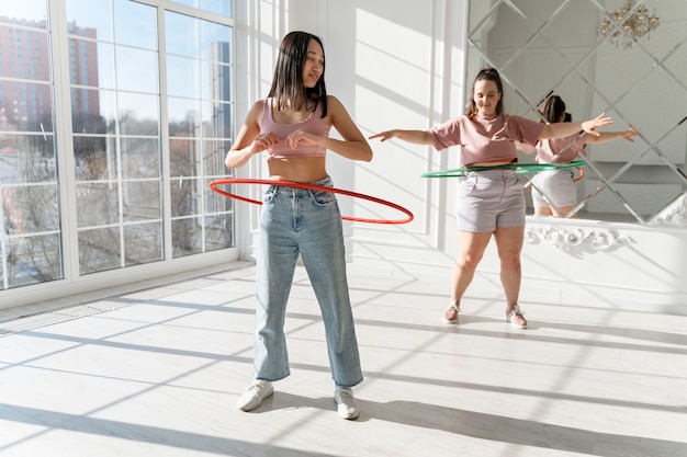 Young women with hula hoops