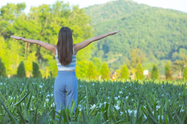 Young women with open arms happily