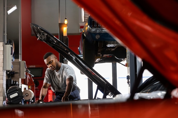 Young worker in a car workshop