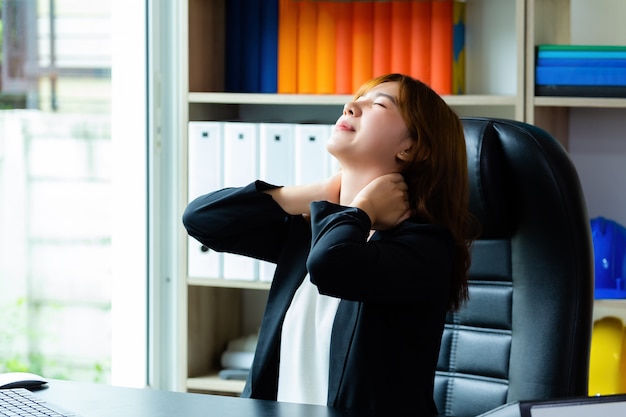 Free photo young working woman neck pain