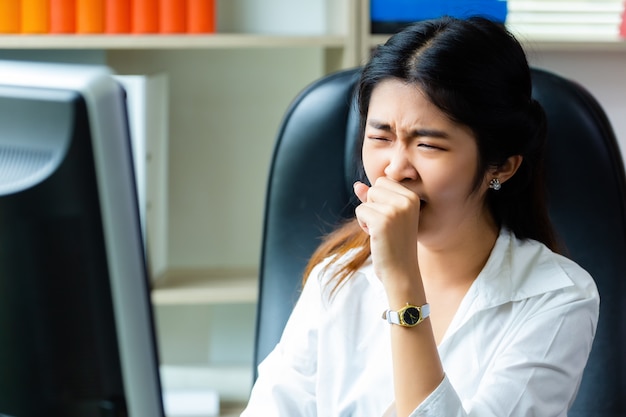 Young working woman tired to work