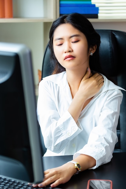 Young working woman tired to work