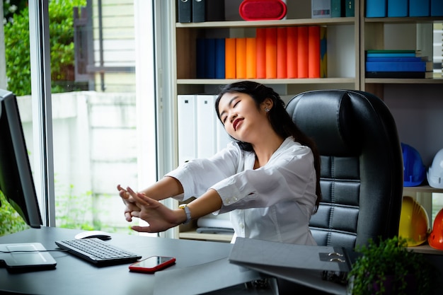 Young working woman tired to work