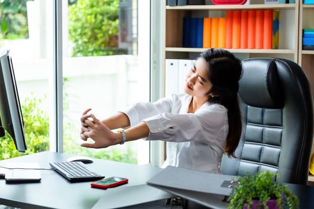 Young working woman tired to work