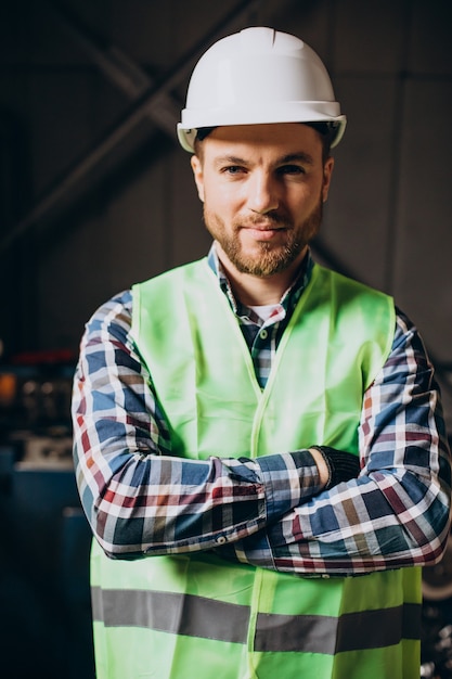 Young workman wearing white hard hat