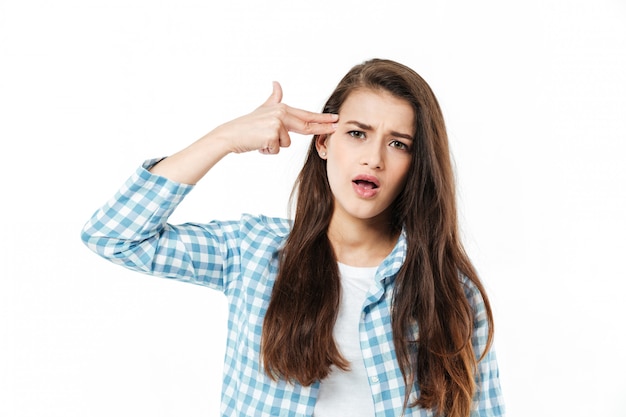 Young young woman showing finger gun gesture isolated