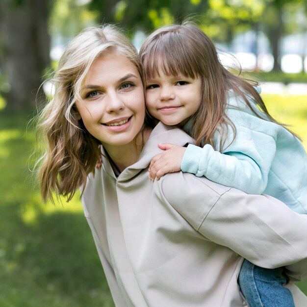 Youngster outdoors and mom portrait