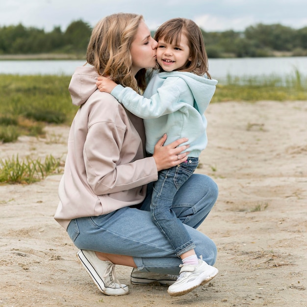 Youngster outdoors and mommy