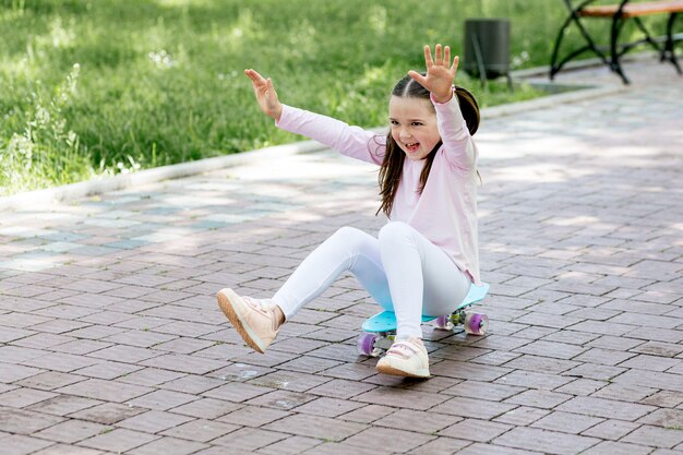 Youngster outdoors playing with a skateboard