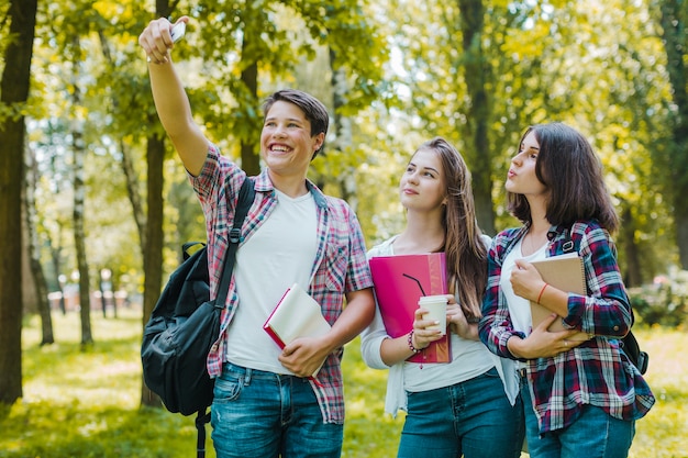 Youngsters posing for selfie in park