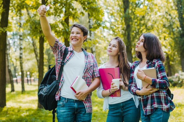 Youngsters posing for selfie in park