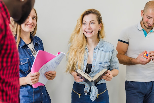 Youngsters with books talking