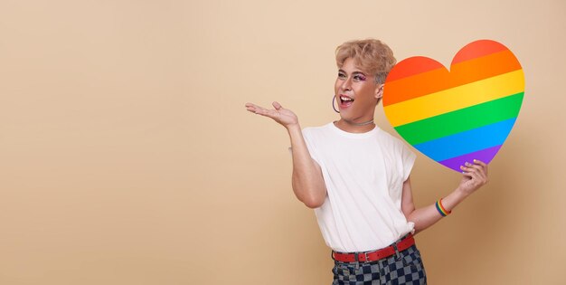 Youth asian transgender LGBT showing Rainbow heart