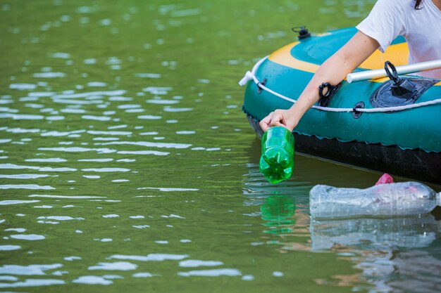 Youth collect garbage in the river, concept of National Youth Day and World Environment Day.