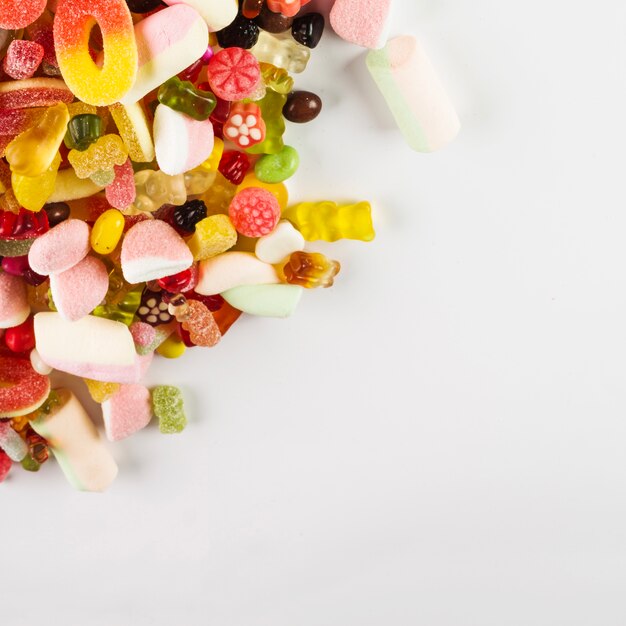 Yummy candies on white background