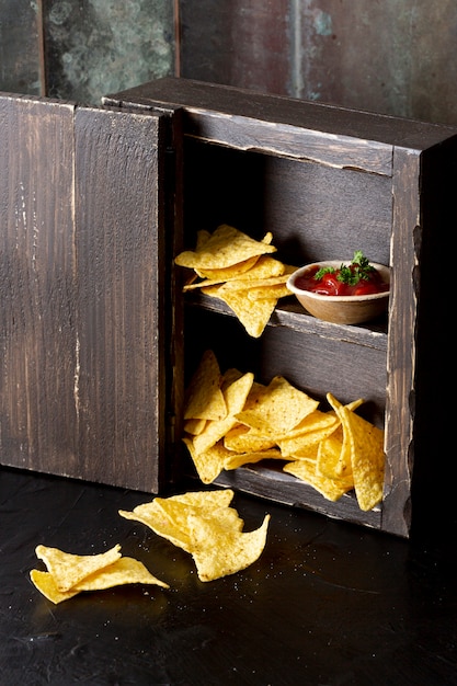 Free photo yummy corn chips and relish in cupboard