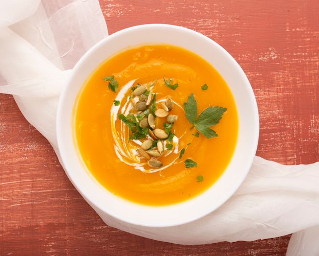 Yummy cream soup with seeds and  parsley