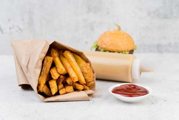 Yummy french fries with blurred burger