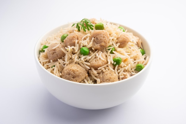 Yummy soya pulao or pilav or pulav or rice or soyabean chunk fried rice with peas and beans, indian or pakistani cuisine