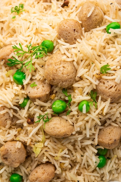 Yummy soya pulao or pilav or pulav or rice or soyabean chunk fried rice with peas and beans, indian or pakistani cuisine Free Photo