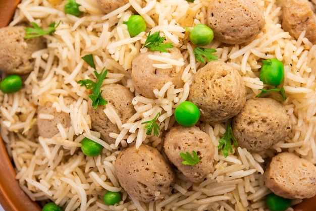 Yummy soya pulao or pilav or pulav or rice or soyabean chunk fried rice with peas and beans, indian or pakistani cuisine