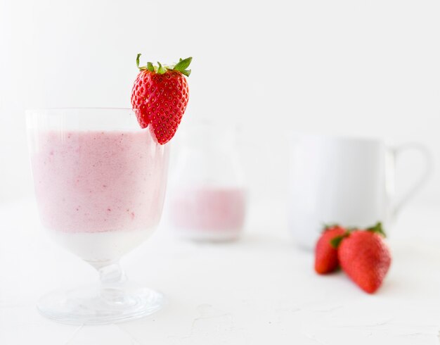 Yummy strawberry milkshake in glasses