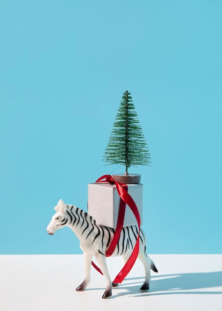 Zebra with gift and fir tree