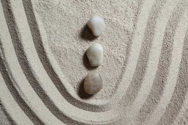 Free photo zen garden with raked sand and stones