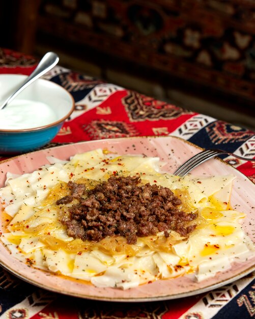 Ð°zerbaijani khinkali with meat sauce and fried onions