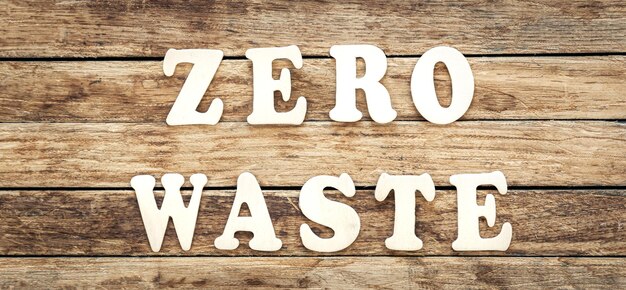 Free photo zero waste written on wood letters on wooden background top view