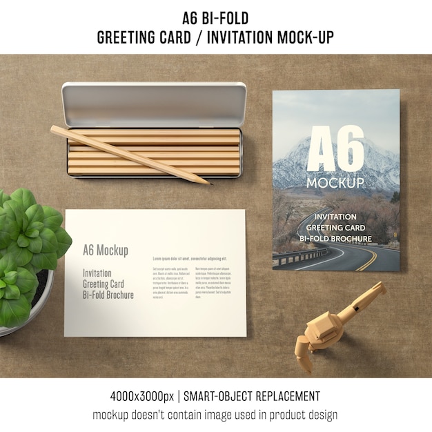 Free PSD a6 bi-fold greeting card mockup with basil