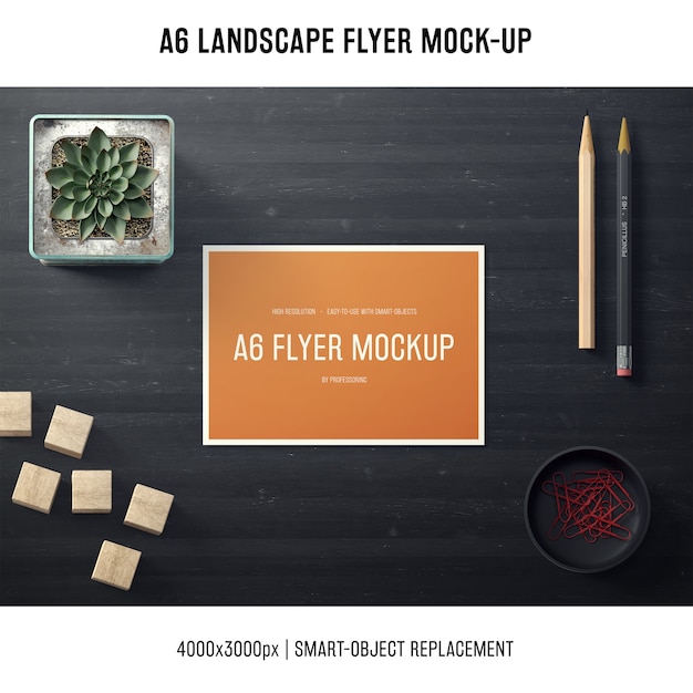 Free PSD a6 landscape flyer mock-up with plant